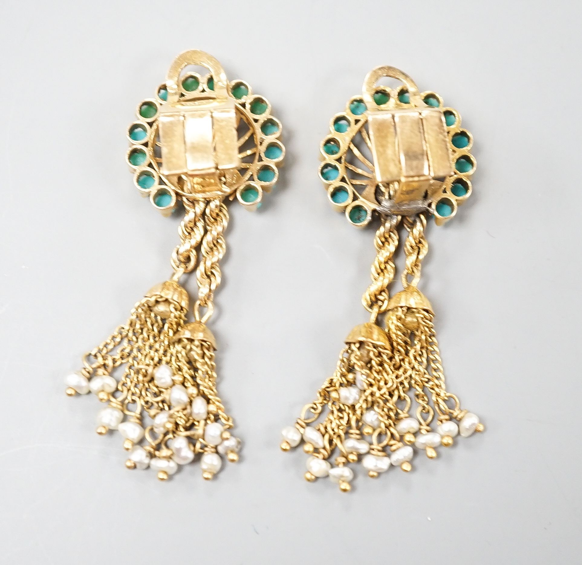 A pair of 20th century Middle Eastern yellow metal, seed pearl and turquoise set tassel drop ear clips, 47mm, gross weight 12.5 grams.